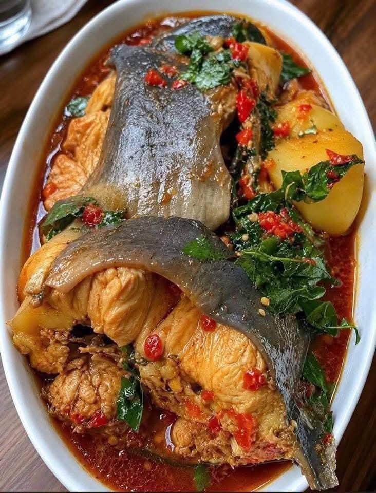 Fish pepper soup with potatoes and herbs in a rich pepper broth