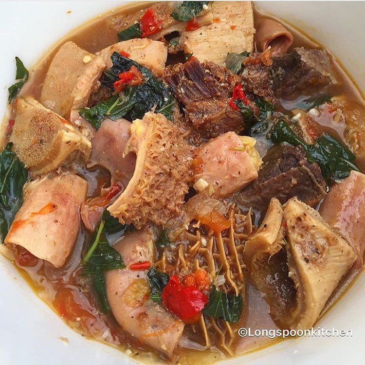 Orisirisi pepper soup with assorted cow parts and scent leaf